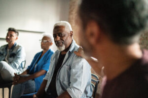 Senior man receiving a advice during a psychotherapy